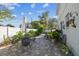 Brick patio area with dining and backyard featuring privacy fence at 2721 W Gray St, Tampa, FL 33609