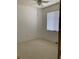 Bedroom features white walls, carpet and a fan at 30049 Emmetts Ct, Wesley Chapel, FL 33543