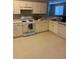 Functional kitchen featuring white appliances, ample cabinetry, and lots of counter space at 30049 Emmetts Ct, Wesley Chapel, FL 33543