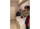 Laundry room with washer, dryer, and shelving at 30049 Emmetts Ct, Wesley Chapel, FL 33543