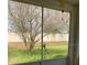 Relaxing patio offers a serene view of the manicured backyard and mature trees at 30049 Emmetts Ct, Wesley Chapel, FL 33543