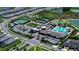 Aerial view of the community with swimming pool, tennis courts, bocce ball and a parking lot at 31452 Cabana Rye Ave, San Antonio, FL 33576