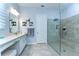 Modern bathroom with a glass-enclosed shower, dual sinks, and neutral tones for a spa-like experience at 31452 Cabana Rye Ave, San Antonio, FL 33576