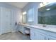 Elegant bathroom featuring double sinks, quartz countertops, and a separate water closet for added privacy at 31452 Cabana Rye Ave, San Antonio, FL 33576