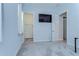 Carpeted bedroom with walk-in closet and mounted television at 31452 Cabana Rye Ave, San Antonio, FL 33576