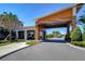 Welcoming community entrance with modern architecture, lush landscaping, and manicured flowerbeds at 31452 Cabana Rye Ave, San Antonio, FL 33576