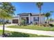 A well-maintained single-story home featuring lush landscaping, brick driveway, and a welcoming entrance at 31452 Cabana Rye Ave, San Antonio, FL 33576