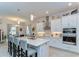 Bright, modern kitchen with a large center island, stainless steel appliances, and pendant lighting at 31452 Cabana Rye Ave, San Antonio, FL 33576