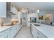 Modern kitchen featuring white cabinets, quartz countertops, stainless steel appliances, and tile backsplash at 31452 Cabana Rye Ave, San Antonio, FL 33576