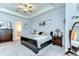 Cozy main bedroom with a comfortable bed, dresser, and ensuite bathroom access at 31452 Cabana Rye Ave, San Antonio, FL 33576