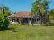 Beautiful backyard view showcasing the home's exterior and surrounding landscape at 34201 Kentucky Derby Pl, Dade City, FL 33525