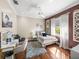 Inviting bedroom with hardwood floors, natural light, and a vanity area at 34201 Kentucky Derby Pl, Dade City, FL 33525