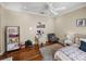 Calming bedroom with hardwood floors and a charming sitting area at 34201 Kentucky Derby Pl, Dade City, FL 33525