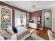 Serene bedroom featuring hardwood floors, decorative walls, and natural lighting at 34201 Kentucky Derby Pl, Dade City, FL 33525