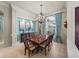 Formal dining room with chandelier lighting and elegant finishes, great for gatherings at 34201 Kentucky Derby Pl, Dade City, FL 33525