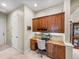 Hallway featuring built-in desk space with storage and views of other rooms at 34201 Kentucky Derby Pl, Dade City, FL 33525