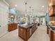 Open kitchen features a large island with views of the dining area and living room at 34201 Kentucky Derby Pl, Dade City, FL 33525