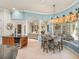 Eat in kitchen features custom cabinetry, large windows, and stainless steel appliances at 34201 Kentucky Derby Pl, Dade City, FL 33525