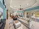 Spacious open floor plan with living, dining, and kitchen areas and an outdoor patio at 34201 Kentucky Derby Pl, Dade City, FL 33525