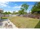 Large backyard with grass lawn and wooden fence creates a private outdoor space at 5261 43Rd N Ave, St Petersburg, FL 33709