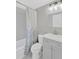 Updated bathroom with shower-tub combo, white shower curtain, tiled walls and vanity with sink at 5261 43Rd N Ave, St Petersburg, FL 33709
