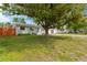 Well-maintained single-Gathering home with a manicured front lawn and mature trees for added curb appeal at 5261 43Rd N Ave, St Petersburg, FL 33709