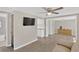Comfortable living room with hardwood floors, neutral paint, and open access to the kitchen and dining area at 5261 43Rd N Ave, St Petersburg, FL 33709