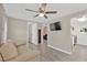 Open-concept living room with modern flooring, neutral walls, and a ceiling fan for comfortable living at 5261 43Rd N Ave, St Petersburg, FL 33709