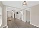 Inviting living room featuring modern floors, neutral paint, and seamless flow to other rooms in the home at 5261 43Rd N Ave, St Petersburg, FL 33709