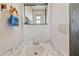 Bathroom with sink, mirror, towel rack, and vanity lighting at 5306 Mary St, Zephyrhills, FL 33542
