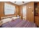 Inviting bedroom with bed, ceiling fan, and an attached bathroom at 5306 Mary St, Zephyrhills, FL 33542