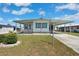 Charming home with a covered carport and well maintained lawn at 5306 Mary St, Zephyrhills, FL 33542