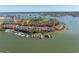 Scenic aerial view of waterfront condos with boat docks, lush landscaping, and tranquil harbor views at 553 Haven Point Dr, Treasure Island, FL 33706