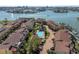 Overhead shot of condos featuring a shared pool, well-kept grounds, parking, and easy waterfront access at 553 Haven Point Dr, Treasure Island, FL 33706