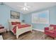 Comfortable bedroom with natural light and a cozy armchair at 553 Haven Point Dr, Treasure Island, FL 33706