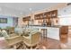 An open dining area with wood floors, mirrored walls, and a glass table with seating at 553 Haven Point Dr, Treasure Island, FL 33706