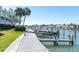 Waterfront dock with boat slips available and clear waterway views of the bay and residential buildings at 553 Haven Point Dr, Treasure Island, FL 33706