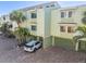 Lovely two-story condo with palm trees, garage, and brick-paved driveway at 553 Haven Point Dr, Treasure Island, FL 33706