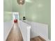 Second story hallway with wood floors and railing at 553 Haven Point Dr, Treasure Island, FL 33706