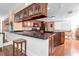 Modern kitchen featuring granite countertops, stainless steel appliances, and wood cabinets at 553 Haven Point Dr, Treasure Island, FL 33706