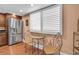 Bright kitchen nook with stainless steel refrigerator and elegant table set for casual dining at 553 Haven Point Dr, Treasure Island, FL 33706