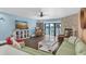 Bright living room with a fireplace, bar, and water views at 553 Haven Point Dr, Treasure Island, FL 33706