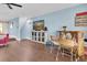 Cozy living room with wood floors, wet bar, and coastal decor offers a relaxed atmosphere at 553 Haven Point Dr, Treasure Island, FL 33706