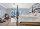 Light filled main bedroom with access to a balcony and views of the water at 553 Haven Point Dr, Treasure Island, FL 33706