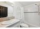 Clean bathroom featuring a single sink, tiled countertop, and a shower-tub combination at 5745 Pawnee St, Zephyrhills, FL 33542
