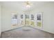 Bright bedroom featuring a bay window that overlooks the front yard at 5745 Pawnee St, Zephyrhills, FL 33542