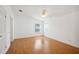 Light bedroom with hardwood floors and windows at 5745 Pawnee St, Zephyrhills, FL 33542