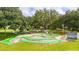 Fun mini golf course surrounded by lush trees for an enjoyable outdoor experience at 5745 Pawnee St, Zephyrhills, FL 33542