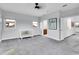 Large bedroom features neutral carpet, natural light, and a white crib with teddy bear at 6113 Pasadena Point Blvd, Gulfport, FL 33707