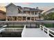This luxurious home features a spacious patio, balconies, and private dock access to the water at 6113 Pasadena Point Blvd, Gulfport, FL 33707